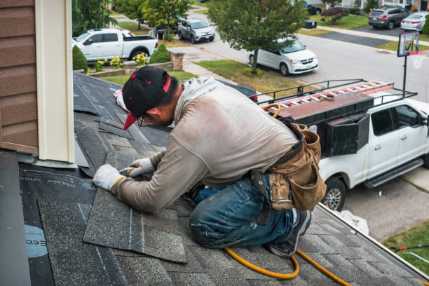 Professional Roofing technician working in North Babylon, NY